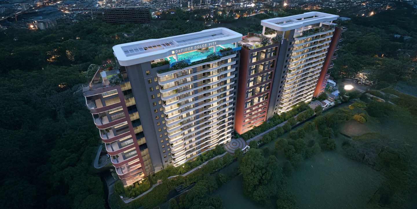 aerial view two modern residential towers with rooftop swimming pool and surrounded by forest in evening 