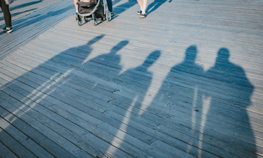 image of shadows of five people on the ground